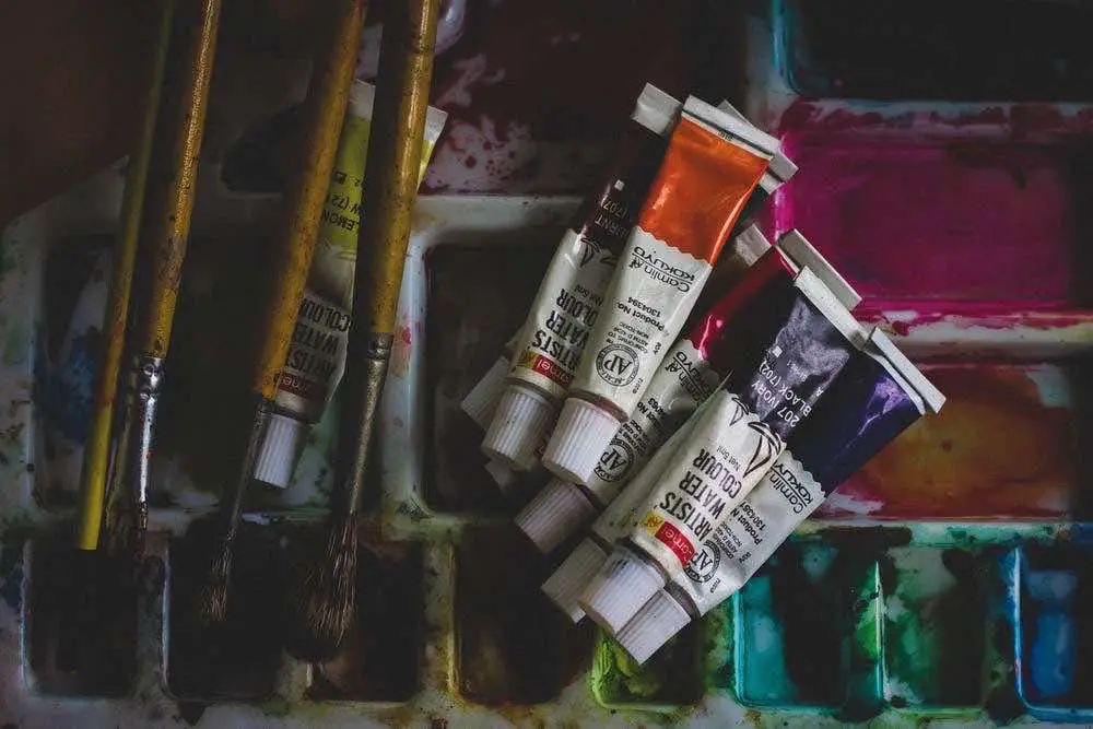 Watercolor tubes, brushes and palette