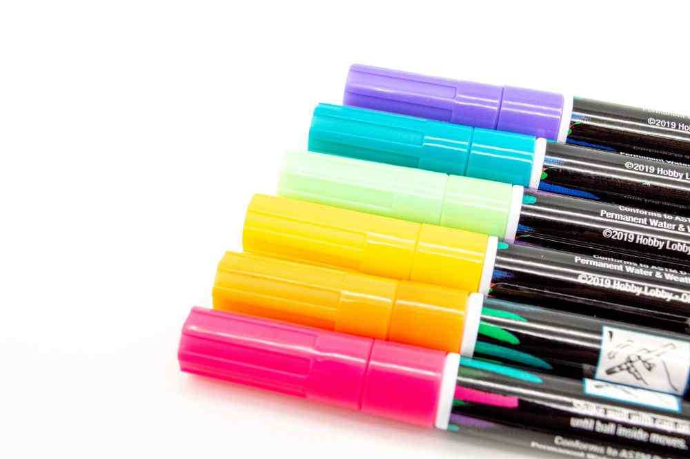 An image of multi-color markers lined up