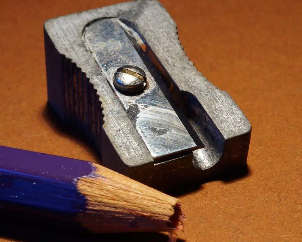 Closeup shot of a broken pencil and a sharpener