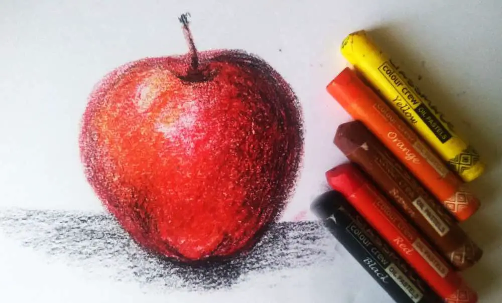 A drawing of an apple created using oil pastels