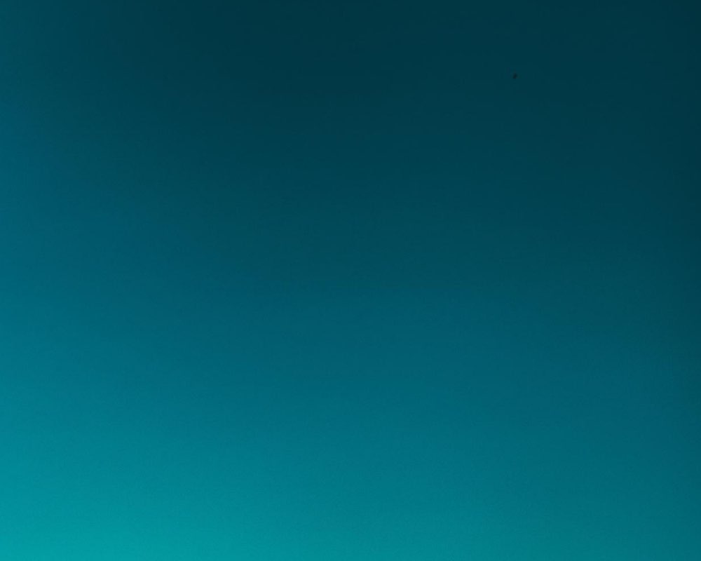An image of a blue-green/aqua sky