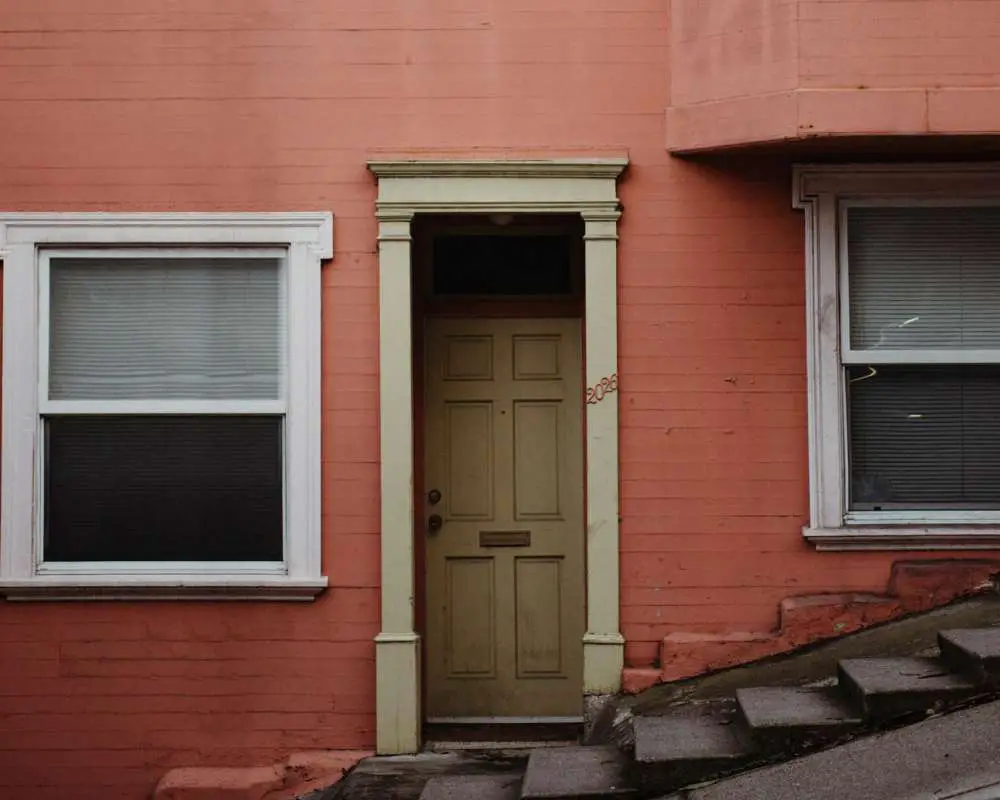 A house with peach painted on the exterior