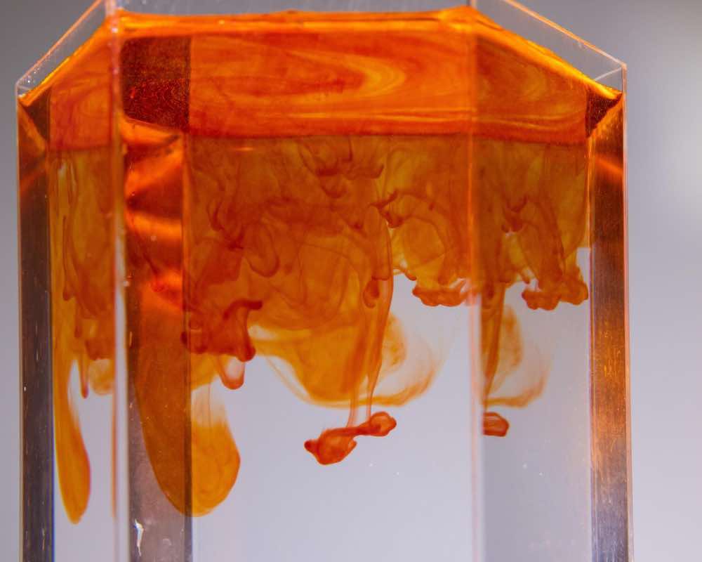Flowy orange ink texture in water